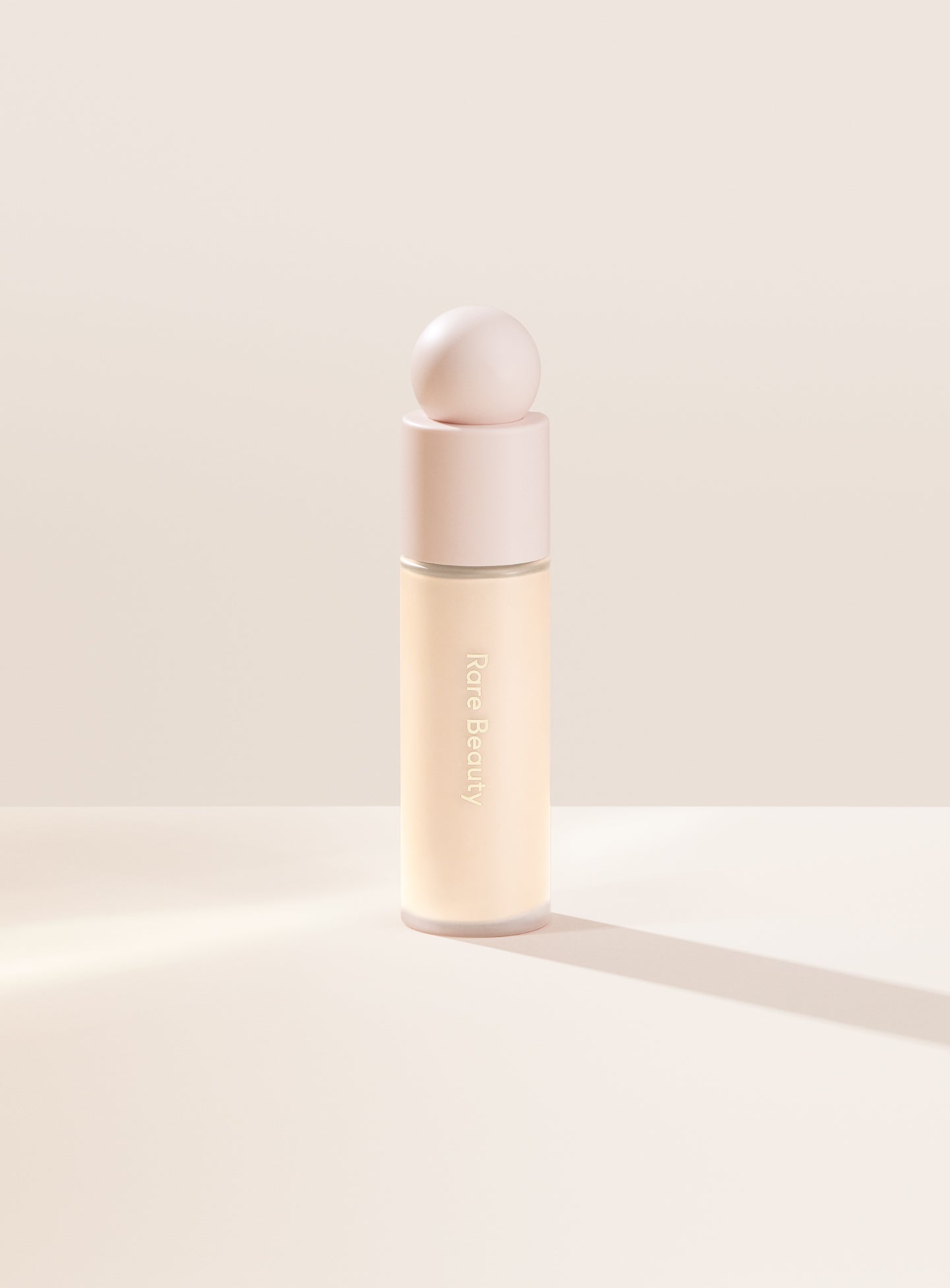 Foundation shade 100W from Rare Beauty's Liquid Touch range, shown as a bottle product image